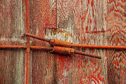 USA, Vermont, St. Johnsbury. Home of Stephen Huneck Gallery, red barn, door and window latch. Art Print